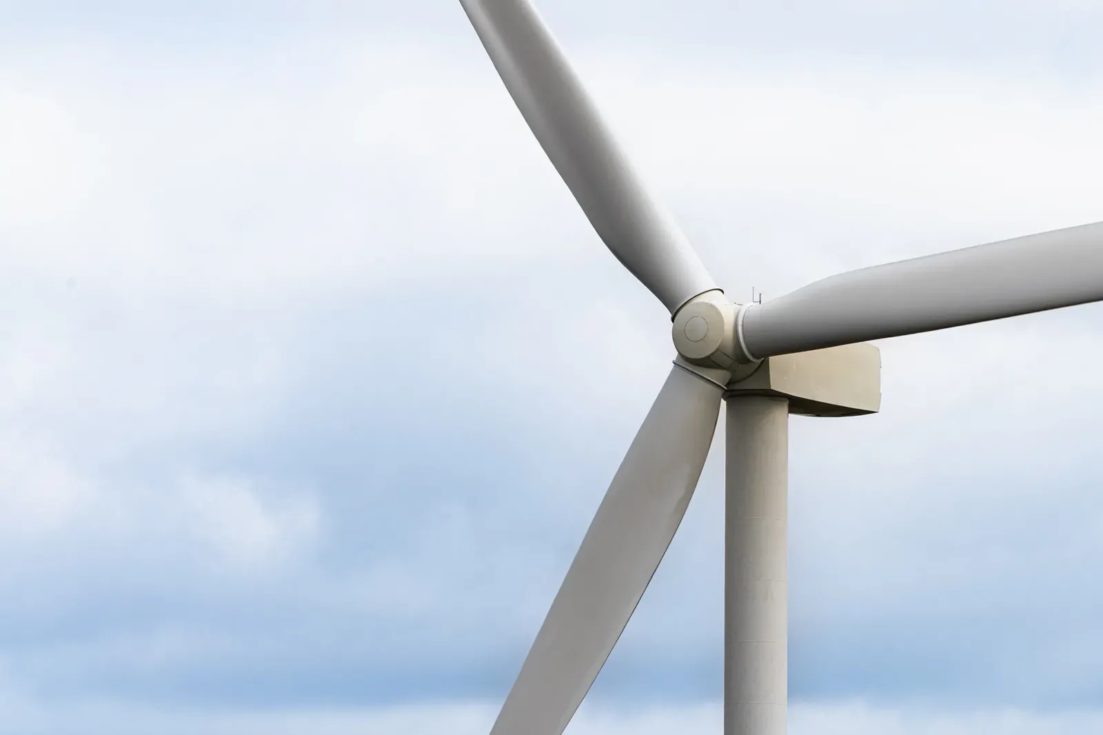 Close-up of a wind turbine nacelle and blades