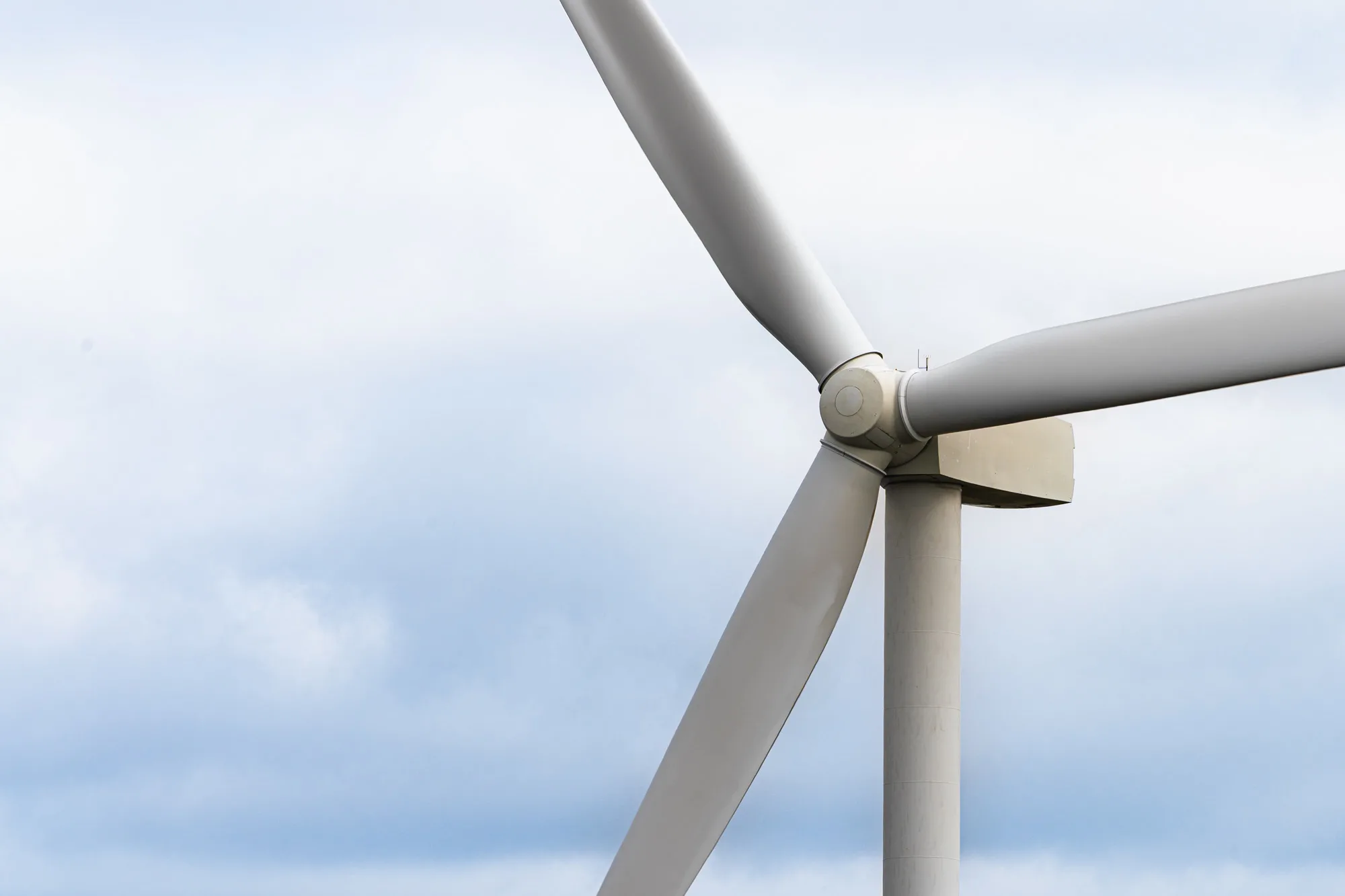 Close-up of a wind turbine nacelle and blades