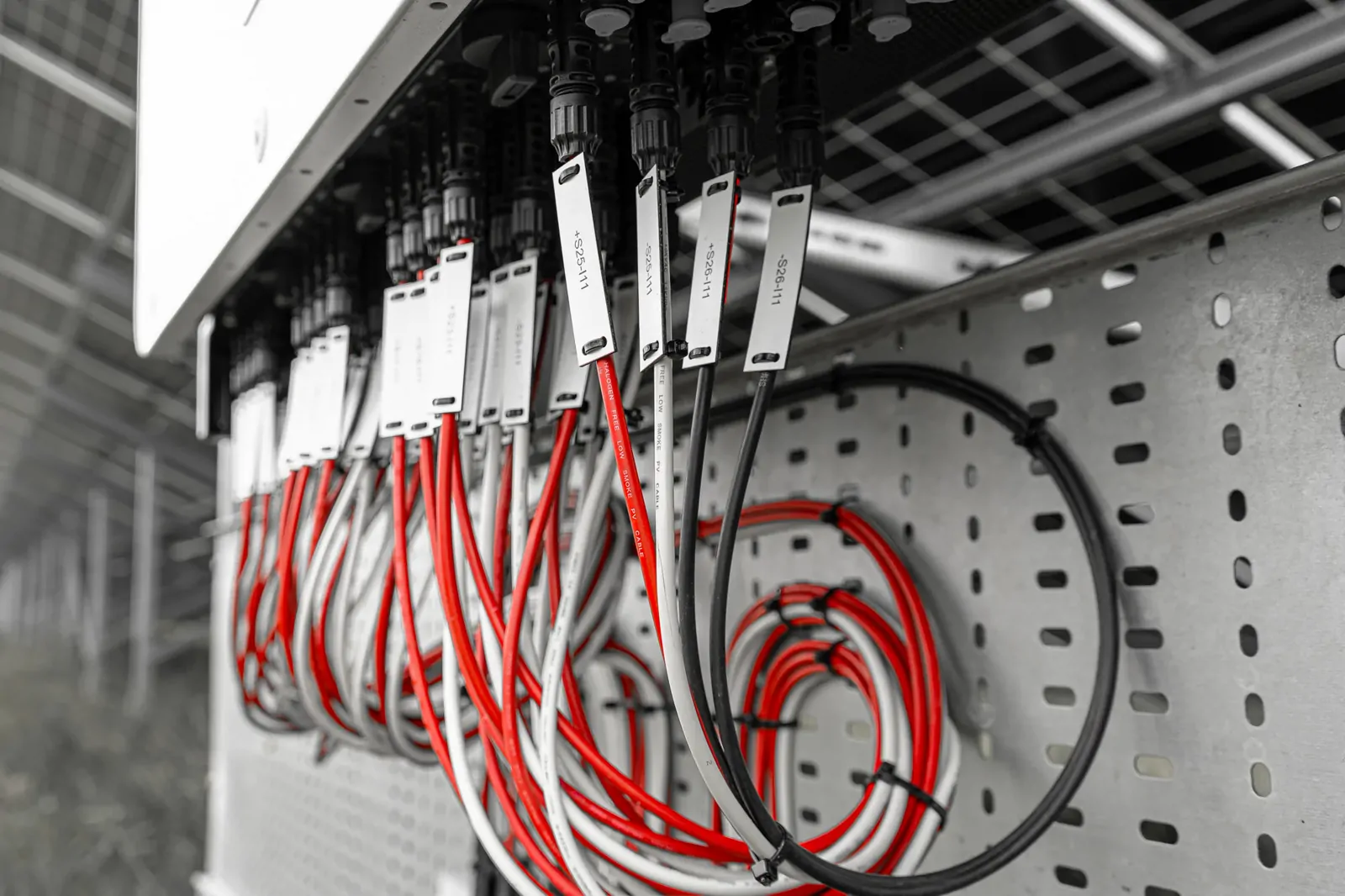 Close-up of solar panel wiring and cable connectors