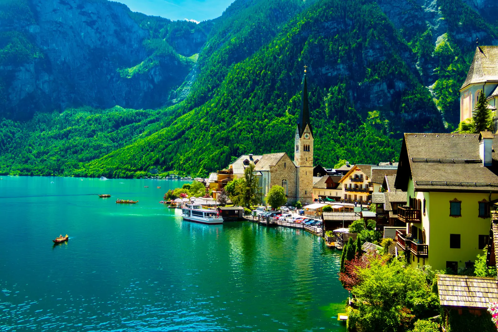 Lakeside village of Hallstatt, Austria, with a church spire against the mountains